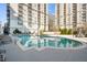 Outdoor pool surrounded by lounge chairs and views of the beautiful building at 195 14Th Ne St # 2105, Atlanta, GA 30309