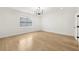 Well lit bedroom featuring hardwood floors, recessed lighting and a view from the window at 3735 Hamilton Mill Rd, Buford, GA 30519