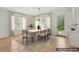 Dining area with modern table, seating for six, and natural light from large windows at 3735 Hamilton Mill Rd, Buford, GA 30519