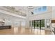 Bright living room featuring a fireplace, hardwood floors, and large windows offering natural light at 3735 Hamilton Mill Rd, Buford, GA 30519