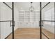 Modern office space featuring built-in shelving, storage cabinetry, a geometric light fixture and window with shades at 3735 Hamilton Mill Rd, Buford, GA 30519