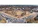 Aerial view of town square with shops, office space, green space, and intersection for pedestrian and vehicle access at 938 Crescent River Pass, Suwanee, GA 30024