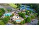 Aerial view showcases the pool, clubhouse, tennis courts, and more community amenities at 938 Crescent River Pass, Suwanee, GA 30024