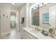 Large bathroom featuring a long vanity with double sinks, and tiled floors at 938 Crescent River Pass, Suwanee, GA 30024