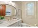 Well-lit bathroom with shuttered window, marble countertop, and updated fixtures at 938 Crescent River Pass, Suwanee, GA 30024