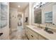 Serene bathroom with a long vanity and walk-in shower at 938 Crescent River Pass, Suwanee, GA 30024