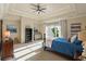Spacious bedroom with trey ceiling, natural light, and a calming color palette at 938 Crescent River Pass, Suwanee, GA 30024