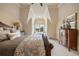 Comfortable bedroom featuring a window seat bathed in natural light at 938 Crescent River Pass, Suwanee, GA 30024