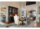 Bright dining room with hardwood floors and elegant built-in at 938 Crescent River Pass, Suwanee, GA 30024