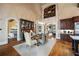 Elegant dining room with high ceilings, arched doorway, and adjacent bar area at 938 Crescent River Pass, Suwanee, GA 30024