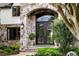 Close-up of the arched, iron-clad double front door at 938 Crescent River Pass, Suwanee, GA 30024
