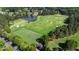 Picturesque golf course with manicured greens, a serene lake, and lush trees surrounding the course at 938 Crescent River Pass, Suwanee, GA 30024