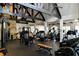Well-equipped gym with various weight machines, free weights, and ample workout space at 938 Crescent River Pass, Suwanee, GA 30024