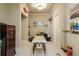 Spacious hallway with neutral decor, carpet flooring, overhead lighting, and interesting artwork at 938 Crescent River Pass, Suwanee, GA 30024