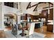 Spacious eat-in kitchen with hardwood floors, island, and elegant lighting at 938 Crescent River Pass, Suwanee, GA 30024