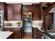 Gourmet kitchen with custom wood cabinets and walk-in pantry at 938 Crescent River Pass, Suwanee, GA 30024