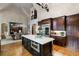 Spacious kitchen featuring a large island, custom cabinets, and stainless steel appliances at 938 Crescent River Pass, Suwanee, GA 30024