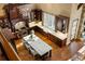 Aerial view of gourmet kitchen with dark wood cabinets and large island at 938 Crescent River Pass, Suwanee, GA 30024