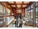 Cozy wood-paneled living room with fireplace, built-in shelving, and plenty of seating at 938 Crescent River Pass, Suwanee, GA 30024