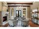 Living room featuring a stone fireplace, seating area, and natural light at 938 Crescent River Pass, Suwanee, GA 30024