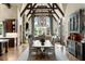 Open-concept living space with a fireplace and views at 938 Crescent River Pass, Suwanee, GA 30024