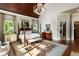 Bright main bedroom with a four-poster bed, hardwood floors, and elegant decor at 938 Crescent River Pass, Suwanee, GA 30024