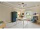 Bright home office with ample lighting, neutral walls, and comfortable seating at 938 Crescent River Pass, Suwanee, GA 30024