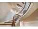 Sweeping staircase with wood treads and wrought iron railing at 938 Crescent River Pass, Suwanee, GA 30024