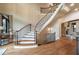 Grand foyer with a curved staircase, hardwood floors, and elegant architectural details at 938 Crescent River Pass, Suwanee, GA 30024