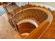 Elegant spiral staircase with hardwood steps and wrought iron railings at 938 Crescent River Pass, Suwanee, GA 30024