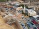 Aerial view of Suwanee Town Center showing City Hall, retail and office space, parking, and community gathering space at 938 Crescent River Pass, Suwanee, GA 30024