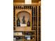 The wine cellar features custom wood shelving and ample storage for all your favorite wines at 938 Crescent River Pass, Suwanee, GA 30024
