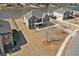 Beautiful aerial view of the brick home featuring a manicured lawn at 141 Aylesbury Blvd, Mcdonough, GA 30252