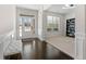 Bright foyer with hardwood floors that leads into the living room at 141 Aylesbury Blvd, Mcdonough, GA 30252