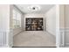 Bright living room showcasing a large bookshelf and window at 141 Aylesbury Blvd, Mcdonough, GA 30252