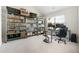 Well-lit office features shelving, and a work area with a desk and computer setup by the window at 141 Aylesbury Blvd, Mcdonough, GA 30252