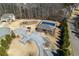 An aerial shot displays the community pool area, along with a playground for residents at 141 Aylesbury Blvd, Mcdonough, GA 30252