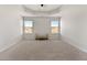 Seating area with plush carpet, bright natural light, a bench, and neutral paint at 141 Aylesbury Blvd, Mcdonough, GA 30252