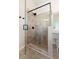 Modern shower with a glass door, tiled walls, rainfall showerhead, and a built-in bench at 141 Aylesbury Blvd, Mcdonough, GA 30252