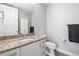 Clean bathroom with granite counters, white cabinets, and modern fixtures at 270 17Th Nw St # 2002, Atlanta, GA 30363