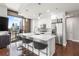 Modern kitchen with island seating, wine rack, stainless appliances, and city skyline views at 270 17Th Nw St # 2002, Atlanta, GA 30363