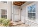 Close up of a well-maintained front door with a storm door and welcome sign at 308 Gettysburg Pl, Atlanta, GA 30350