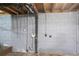 Unfinished basement with gray brick walls showing mechanicals at 928 Magna Carta Nw Dr, Atlanta, GA 30318