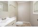 Bathroom features a clean vanity, mirror, and a toilet with tile floors at 928 Magna Carta Nw Dr, Atlanta, GA 30318