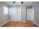 Comfortable bedroom featuring hardwood floors and a spacious closet at 928 Magna Carta Nw Dr, Atlanta, GA 30318