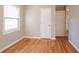 Bedroom showcasing hardwood floors, bright natural light, and neutral wall colors at 928 Magna Carta Nw Dr, Atlanta, GA 30318