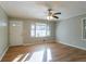 Living room featuring hardwood floors, neutral walls, natural light, and an exterior door at 928 Magna Carta Nw Dr, Atlanta, GA 30318