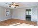 Bright living room with hardwood floors, ceiling fan, and natural light at 928 Magna Carta Nw Dr, Atlanta, GA 30318