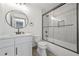 Updated bathroom with modern vanity, round mirror, and shower with sliding glass door at 2357 Lynn Iris Dr, Decatur, GA 30032