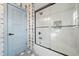Beautiful bathroom with a glass-enclosed shower, modern fixtures, and patterned wallpaper accents at 2357 Lynn Iris Dr, Decatur, GA 30032